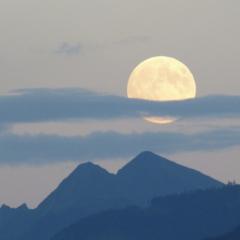The moon with mountains at sunrise